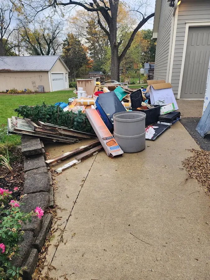 Dumpster being loaded with debris for Residential Dumpster Rental in Roscoe